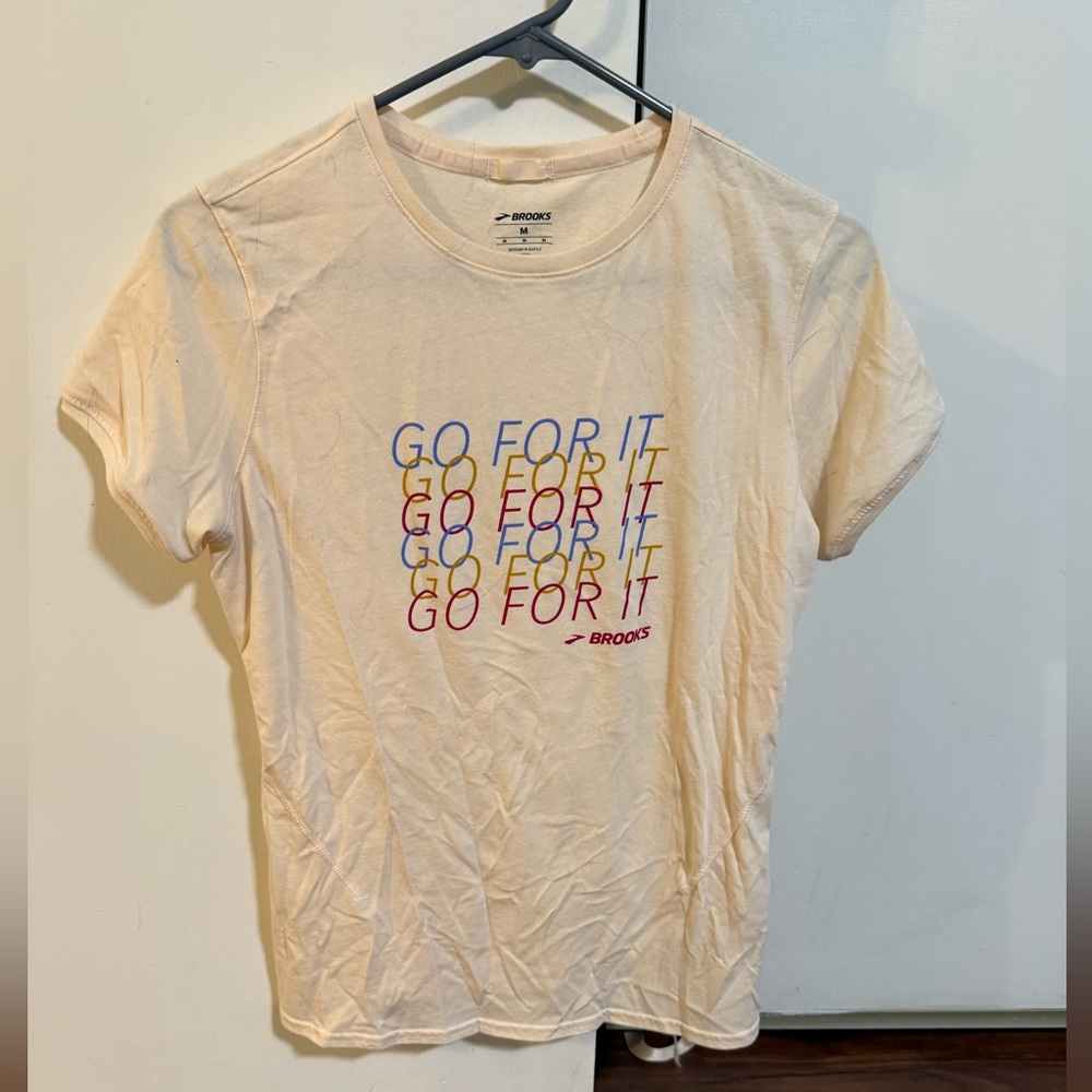Brooks Cream Tee with Multicolor Graphic